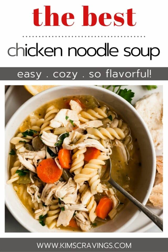 easy chicken noodle soup in a white bowl with a spoon and bread