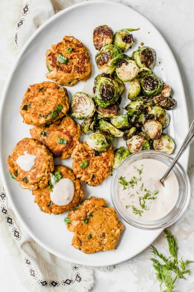 salmon patties and Brussels sprouts with dill sauce