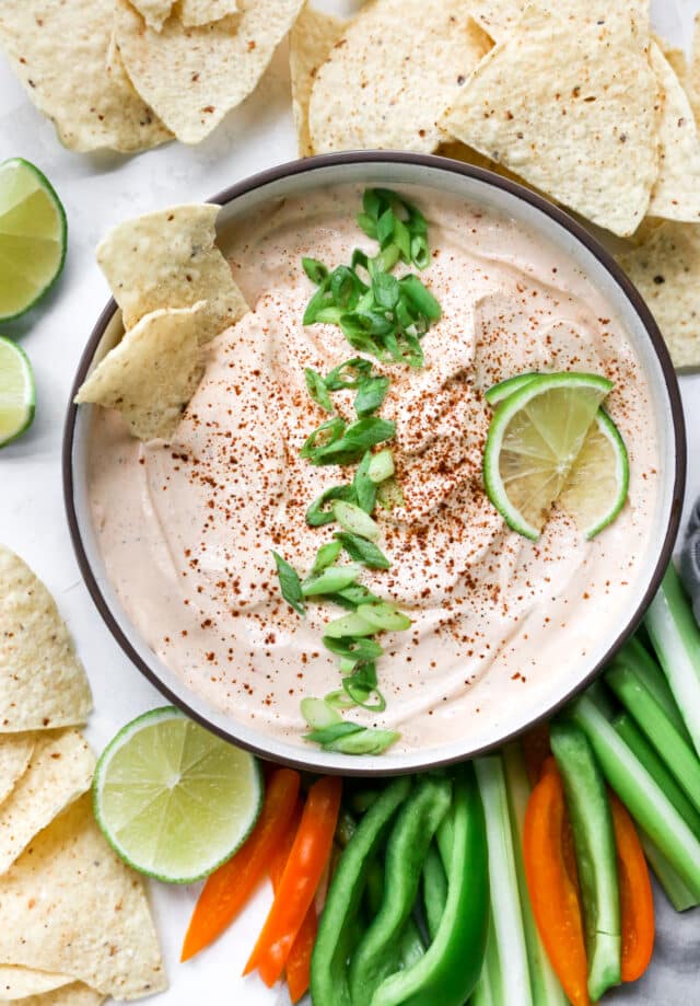 chipotle ranch dressing topped with green onion and lime