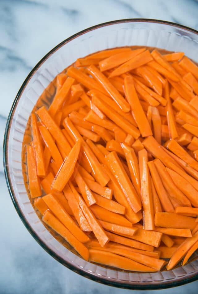 sweet potato fries soaking in cold water