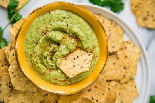 Jalapeño hummus served with chips.