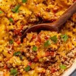 Wooden spoon serving unstuffed bell peppers.