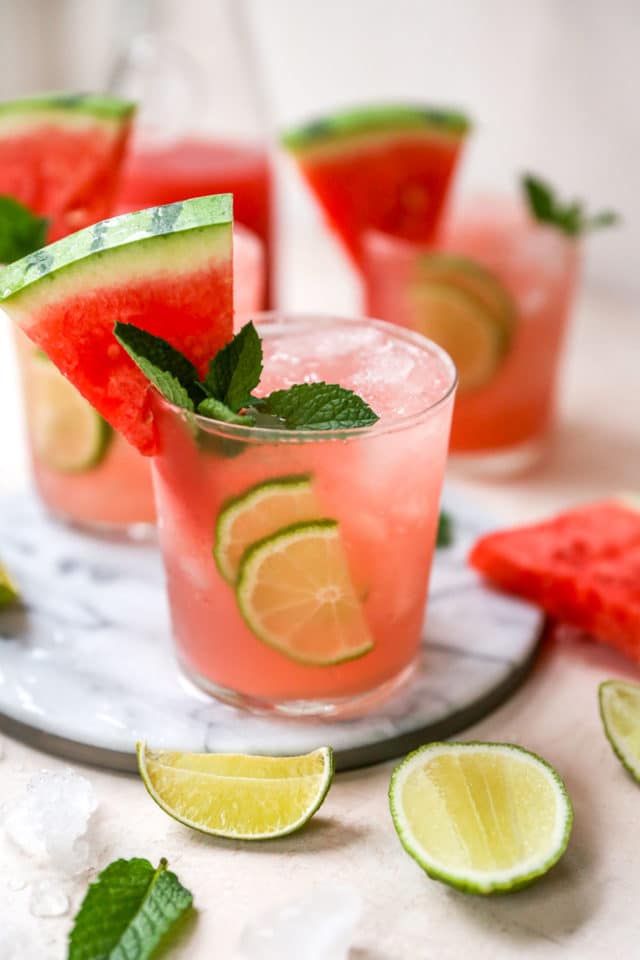 vodka watermelon cocktails garnished with a watermelon slice and fresh mint
