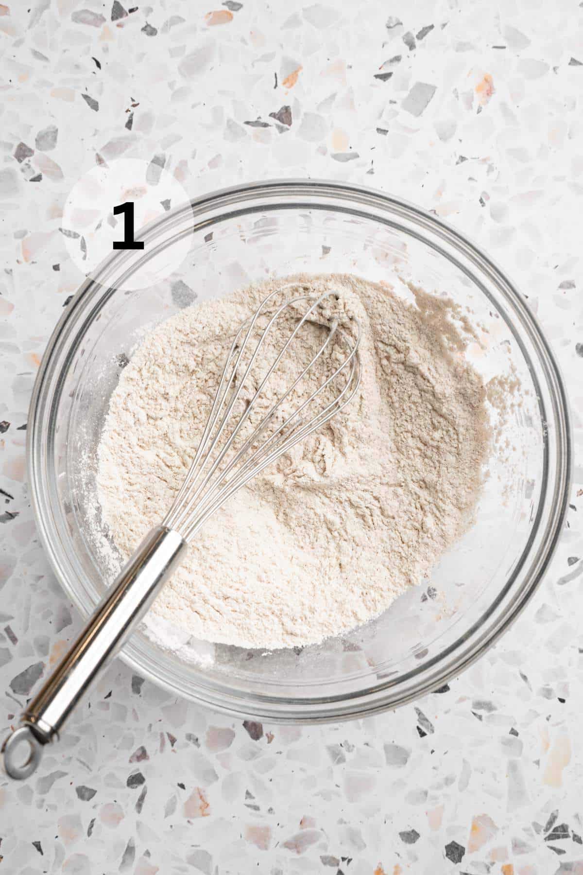 Whisking flour, baking soda and cinnamon in a large bowl.