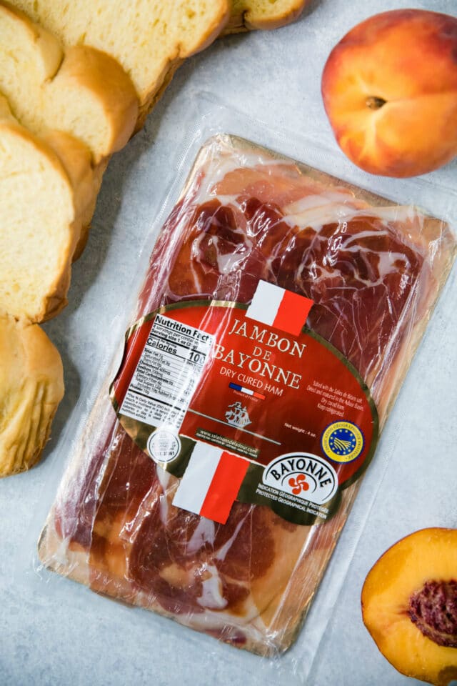 package of Bayonne ham near peaches and bread slices