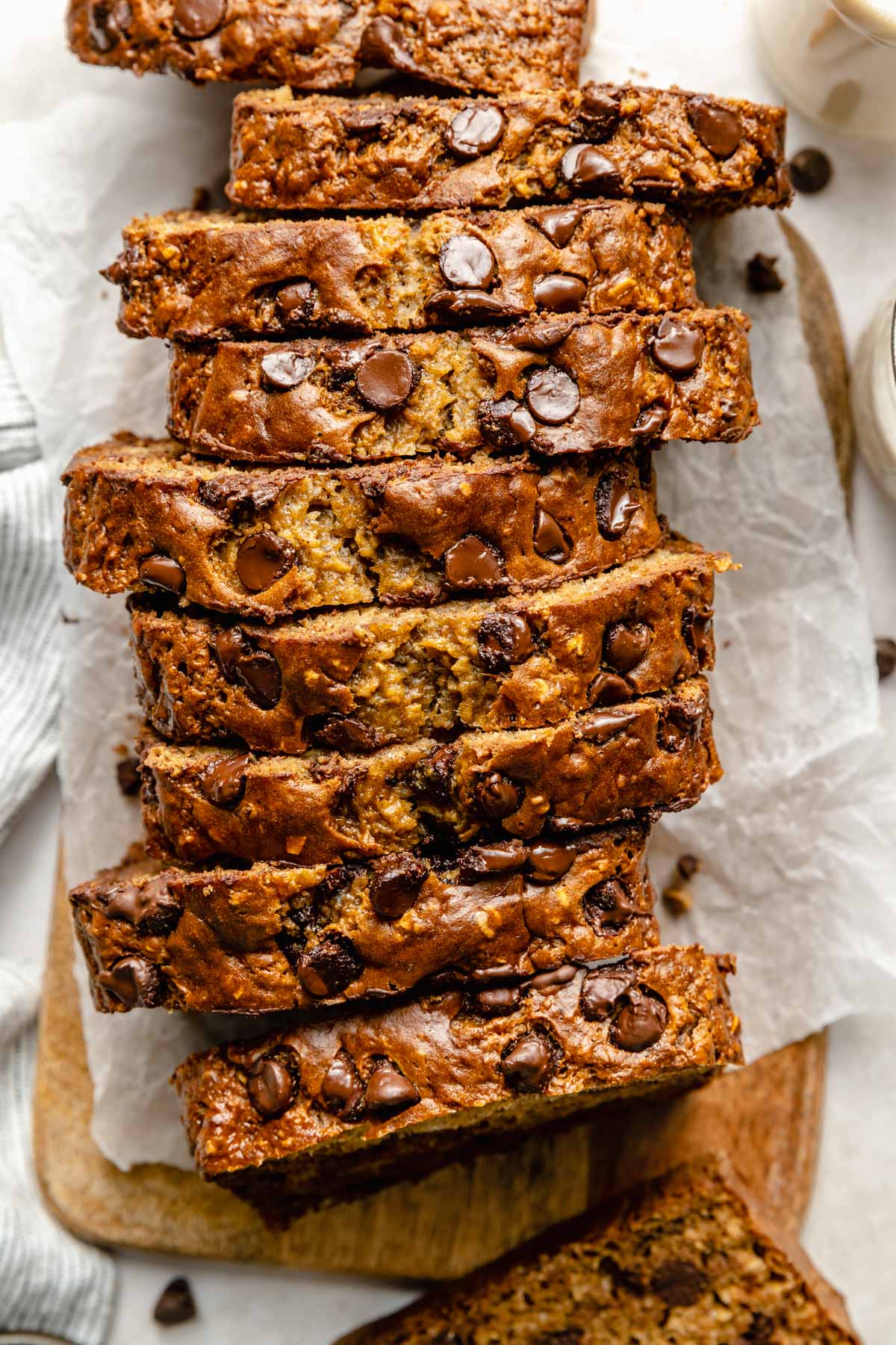 Chocolate chip banana bread sliced on a cutting board.