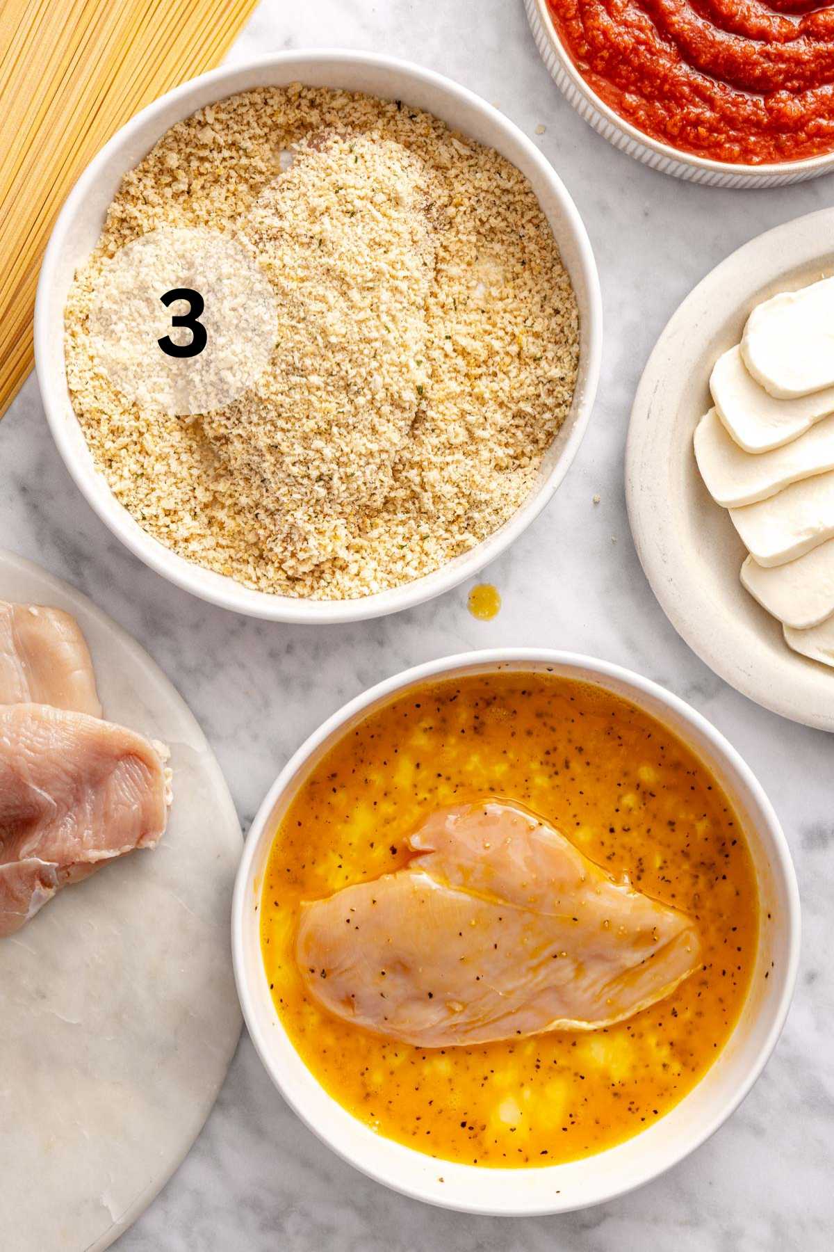 Chicken dipped in egg mixture and in breadcrumb mixture.