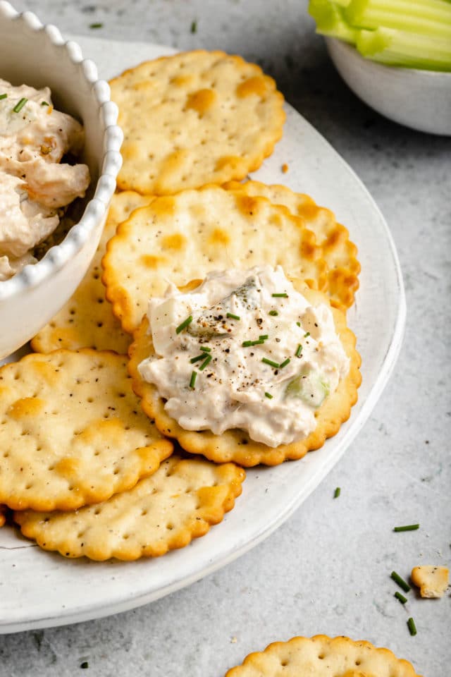 A scoop of tuna salad on a butter cracker.
