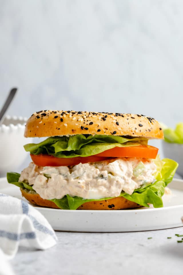 Tuna salad sandwich made with lettuce and tomato.