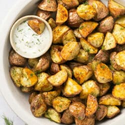 Roasted red potatoes served with ranch dressing.