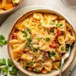 Creamy bow tie pasta served in a bowl with a fork.