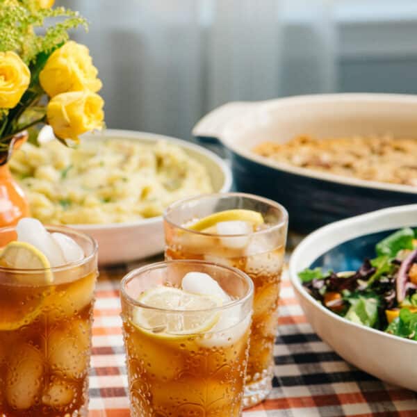 iced tea with lemon on a dinner table with dishes