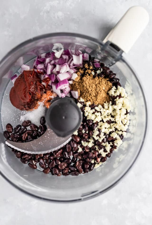 black beans and other veggie burger ingredients in a food processor 