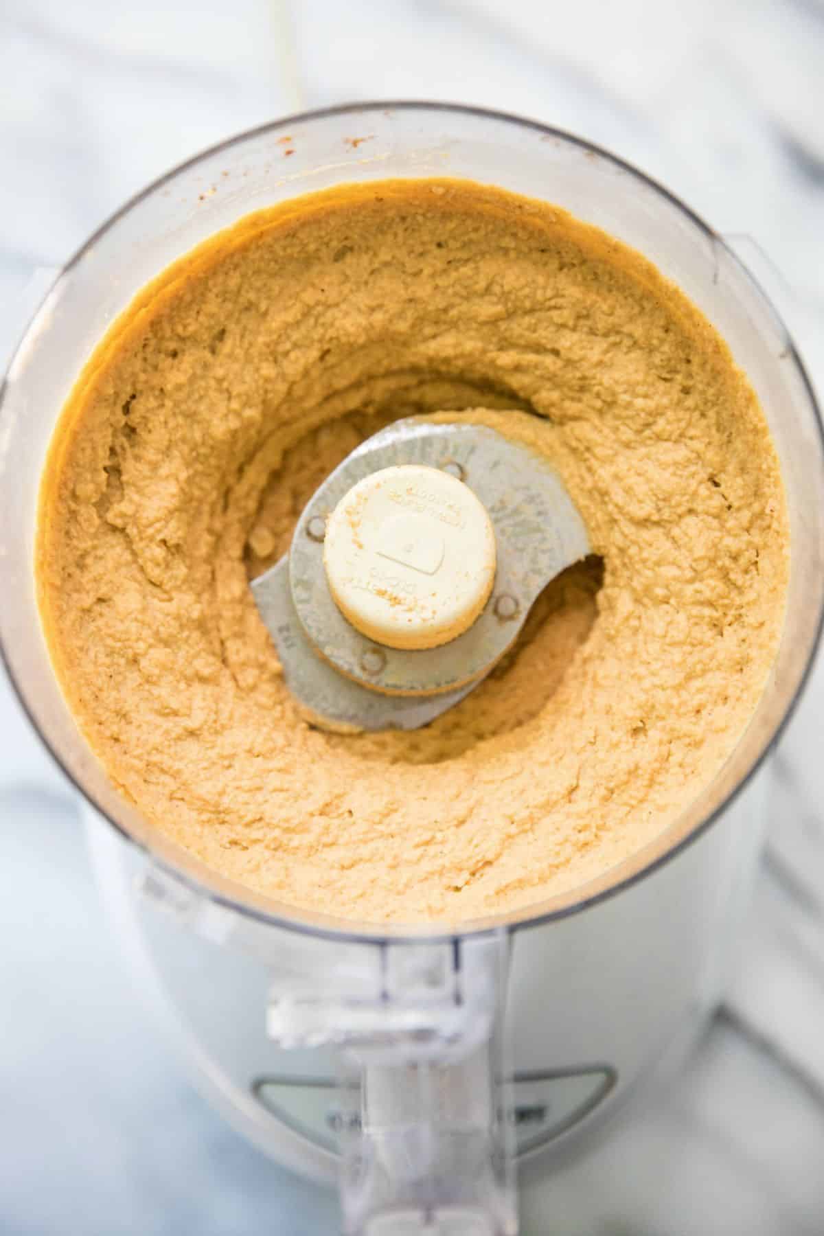Hummus made with pumpkin puree in a food processor.