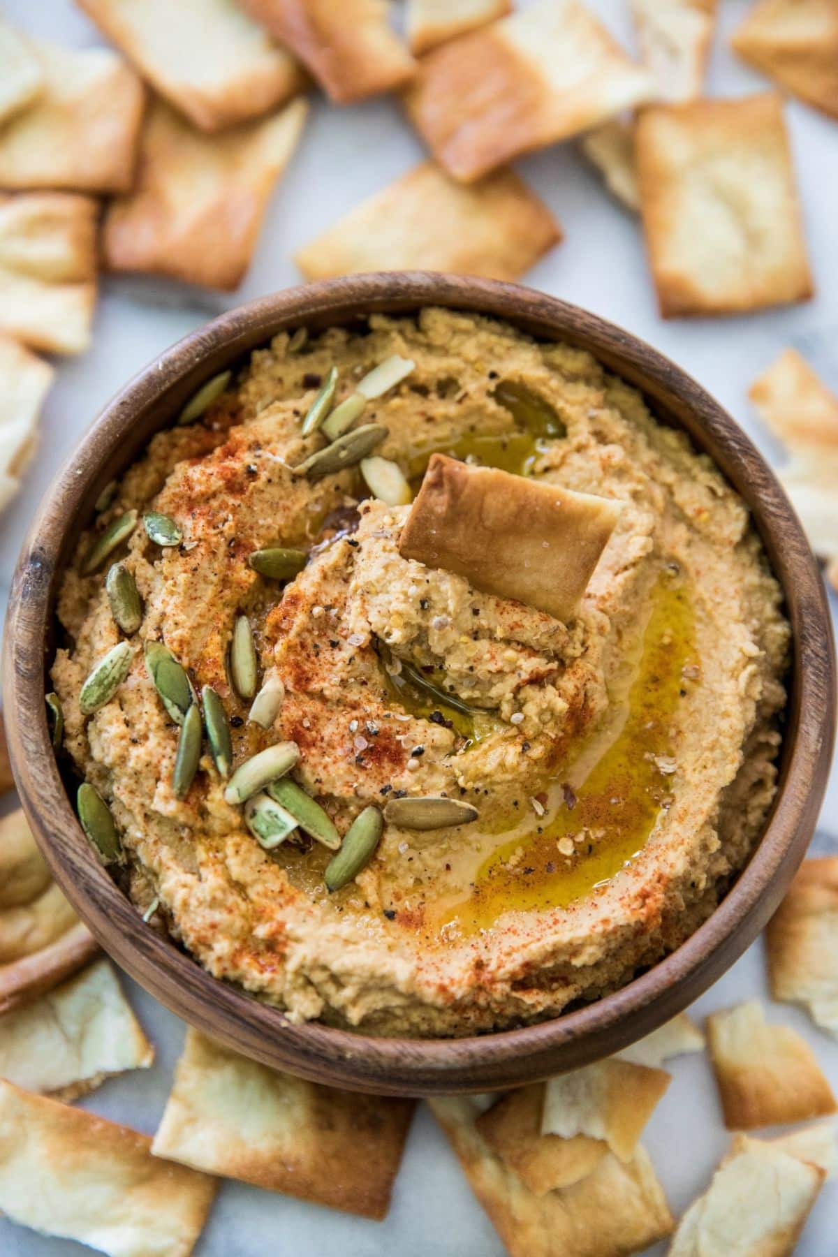 Pumpkin hummus topped with pumpkin seeds, paprika and olive oil.