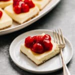 cheesecake bars topped with cherries