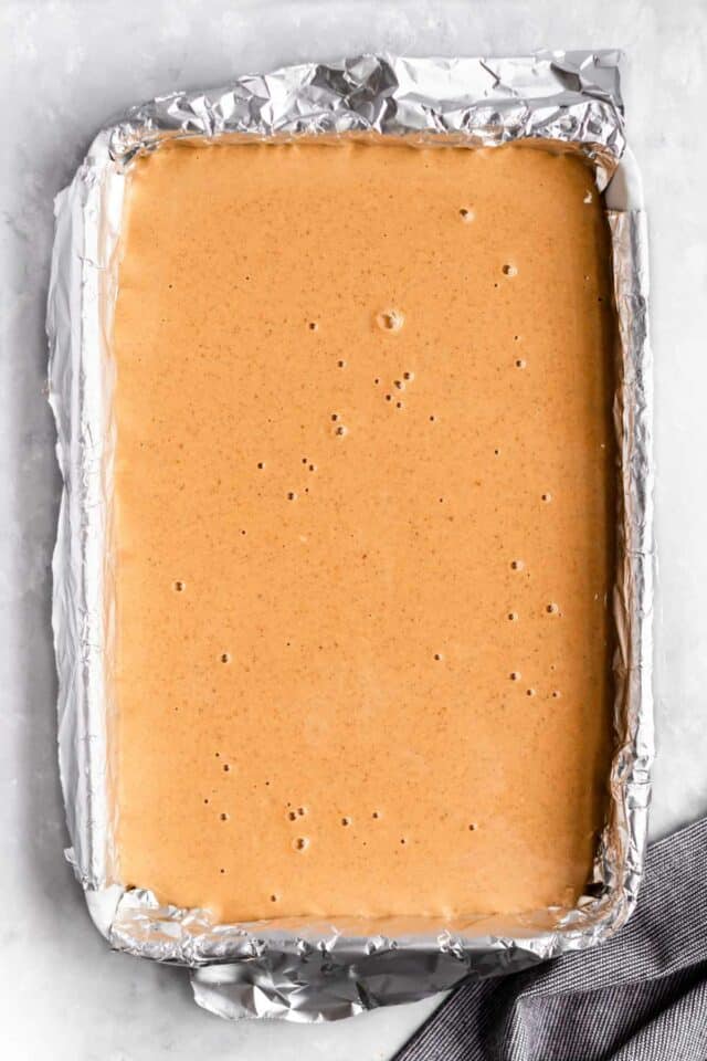 Pumpkin filling poured over a crust.
