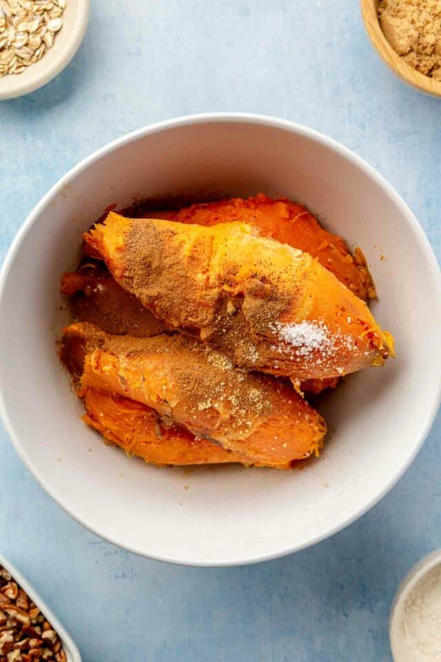 Sweet potatoes in a bowl with spices.