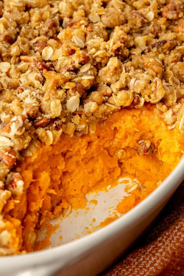 Serving of sweet potato casserole served out of dish.