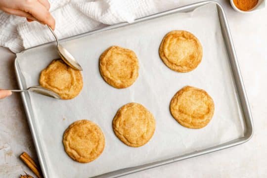 baked snickerdoodles on a baking sheet