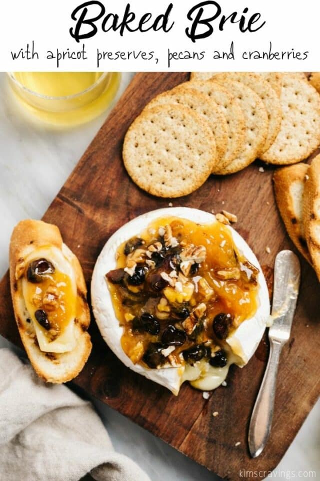 Baked Brie served with crackers and wine