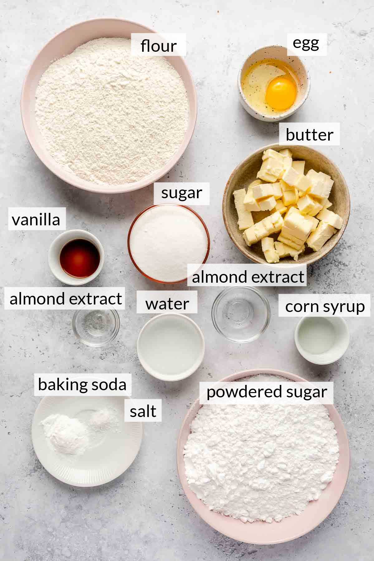 Flour, butter, sugar, egg, vanilla, powdered sugar, corn syrup, baking soda and salt in small bowls.