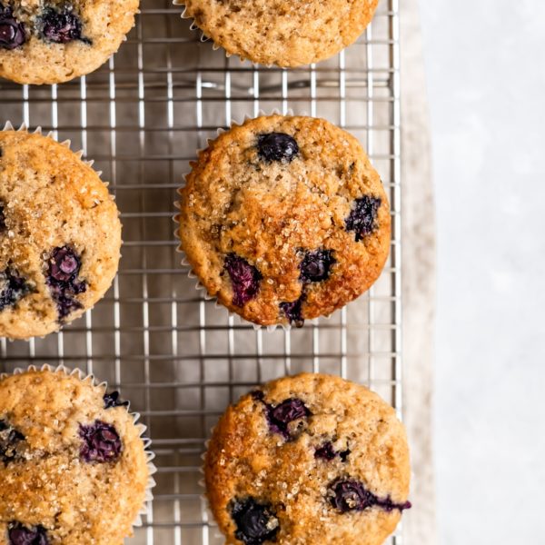 Buttermilk Blueberry Muffins on a wire cooling rack