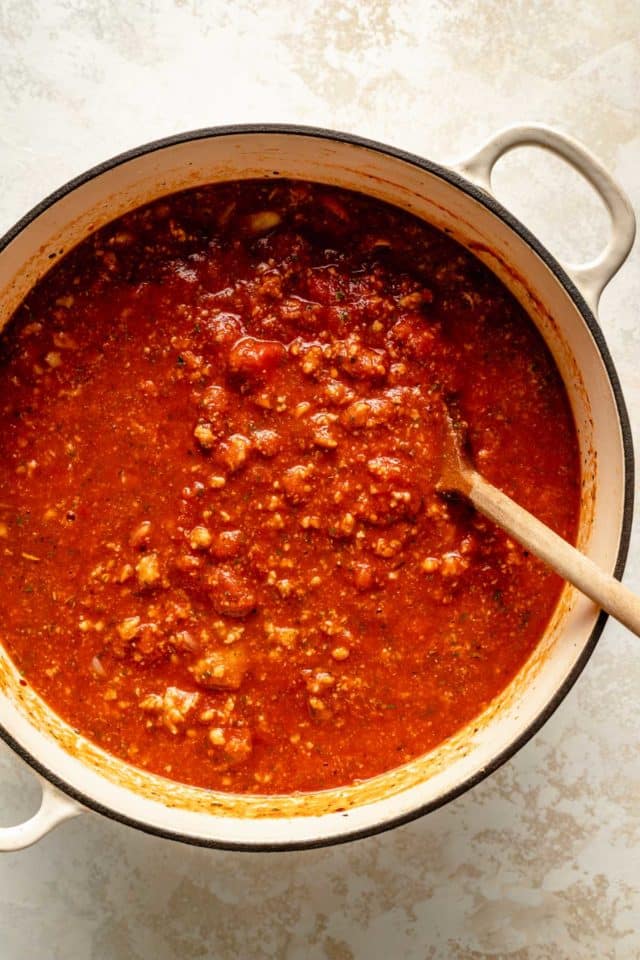Italian sausage meat sauce in a large pot.