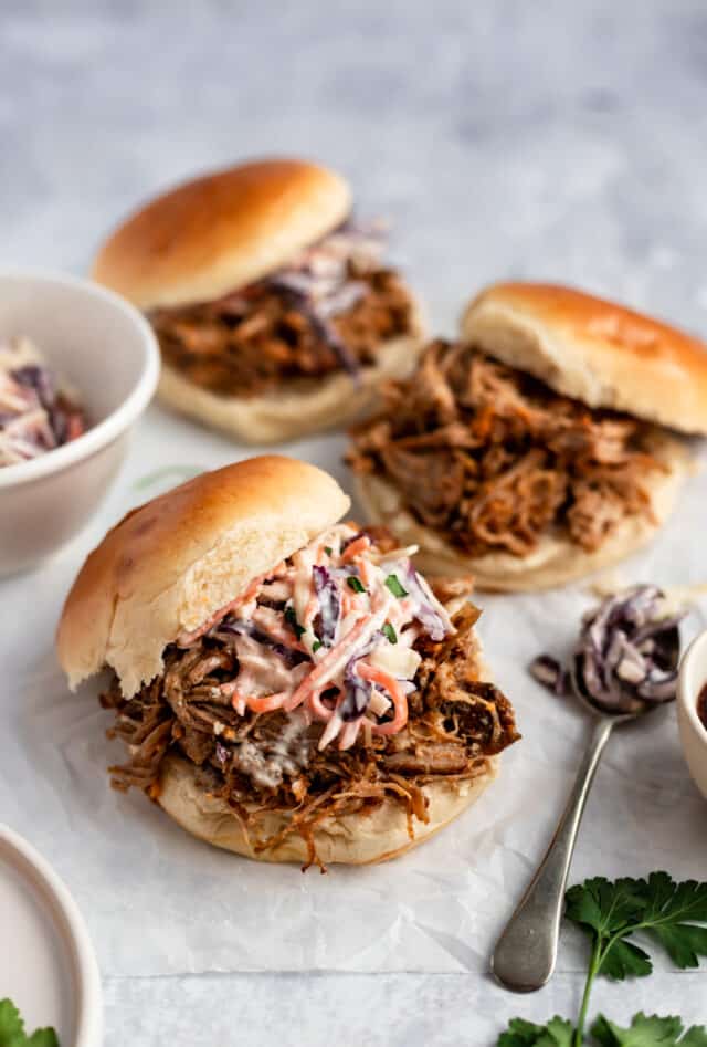 pulled pork sandwich topped with creamy coleslaw
