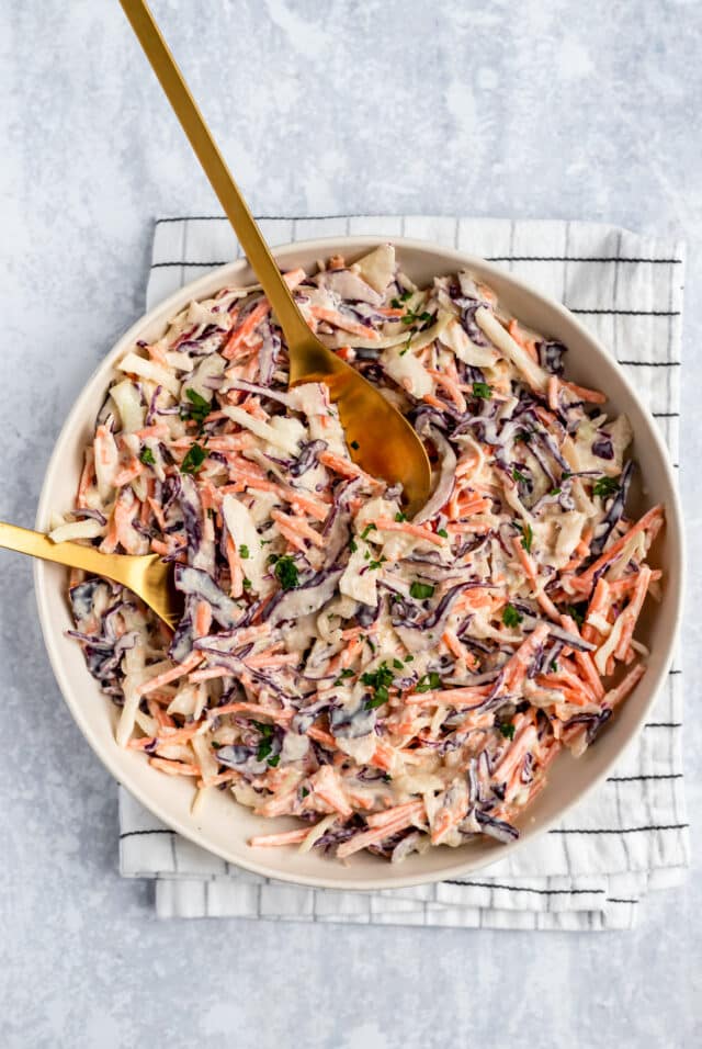 a white bowl filled with the best coleslaw recipe