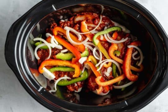 Cooking peppers and chicken in a Crockpot.