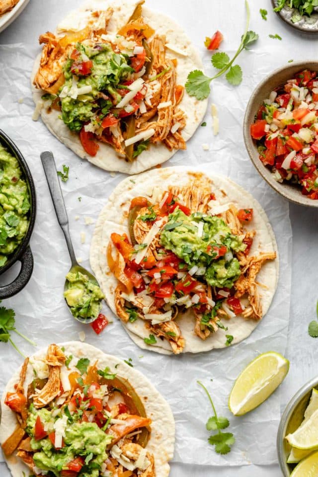 Shredded chicken with peppers served in a tortilla with pico and guac.