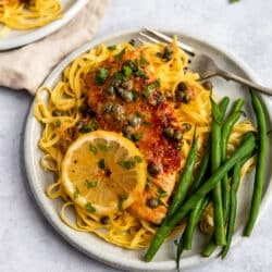 Chicken Piccata Recipe served over pasta with green beans