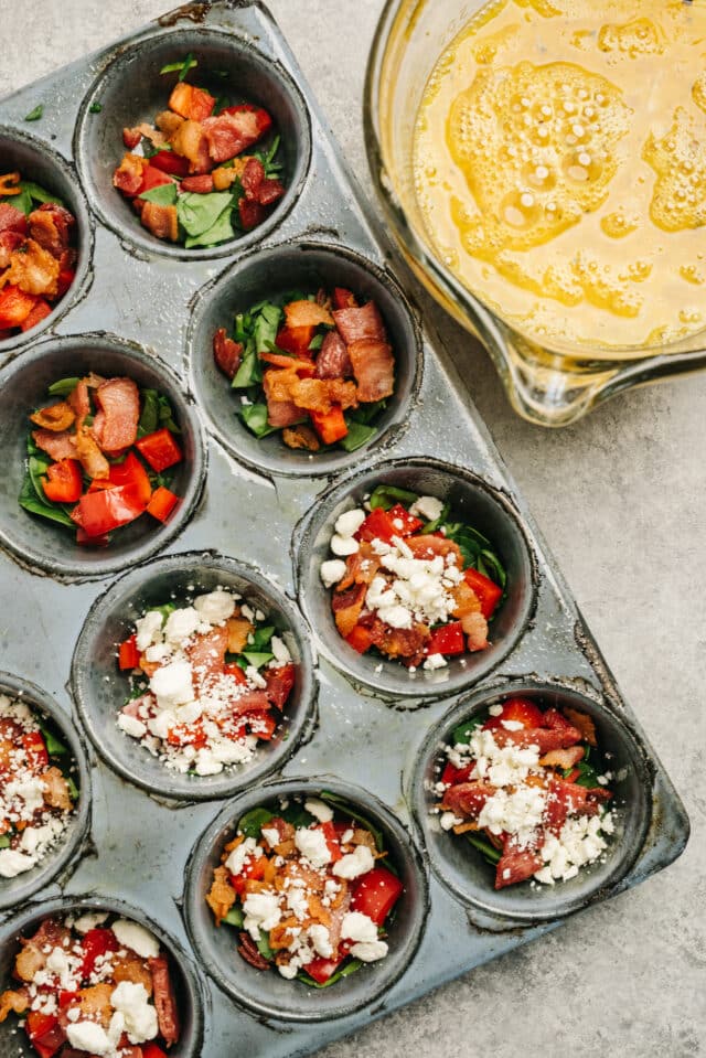 muffin pan filled with veggies for egg cups 