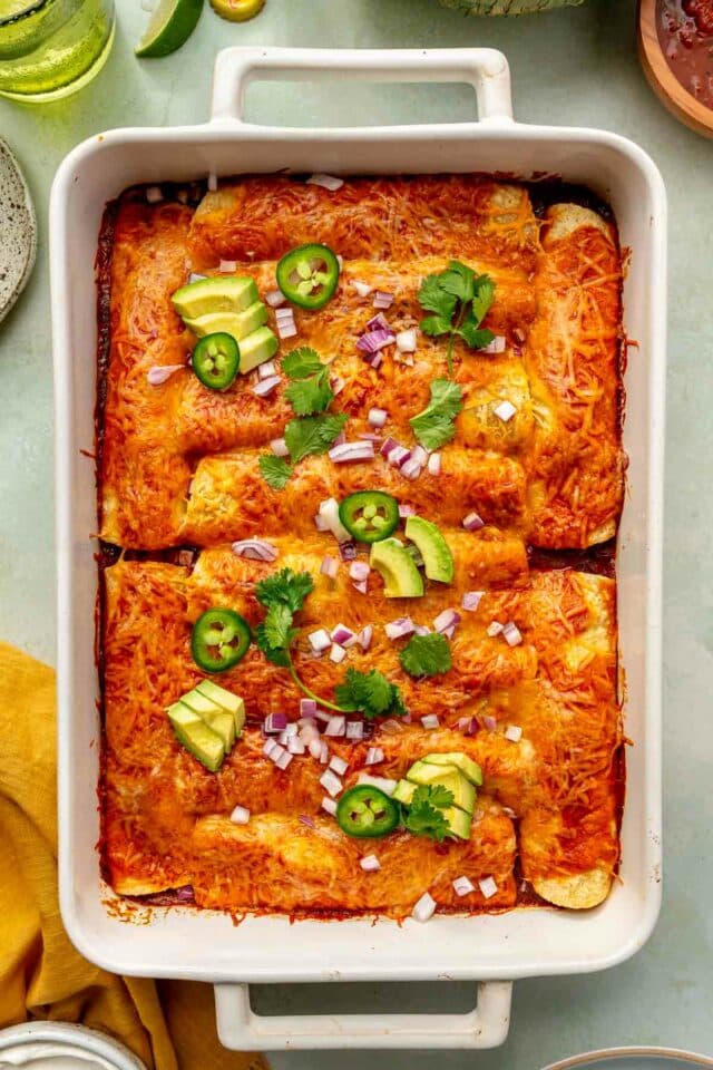 Vegetarian enchiladas topped with fresh jalapeños, red onions and cilantro. 