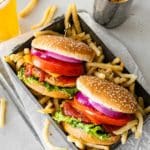 Turkey burgers served with fries and beer.