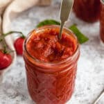 Homemade marinara sauce stored in a mason jar.
