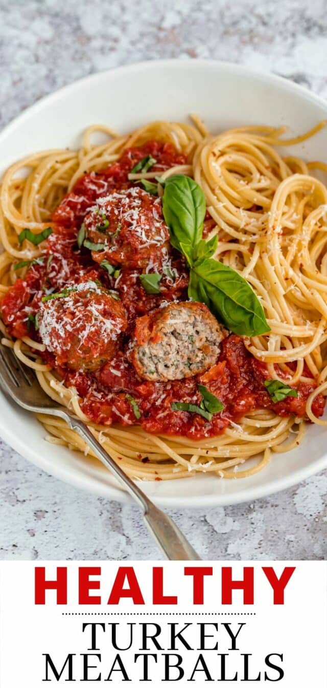 Italian meatballs served with marinara and spaghetti in a white bowl