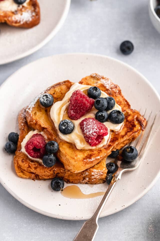 Brioche French toast topped with yogurt and berries