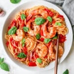 Pasta Pomodoro served with shrimp and fresh basil