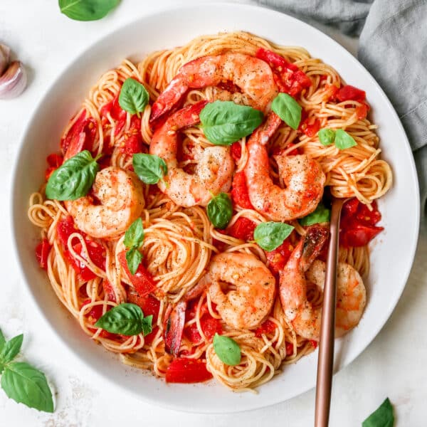 Pasta Pomodoro served with shrimp and fresh basil
