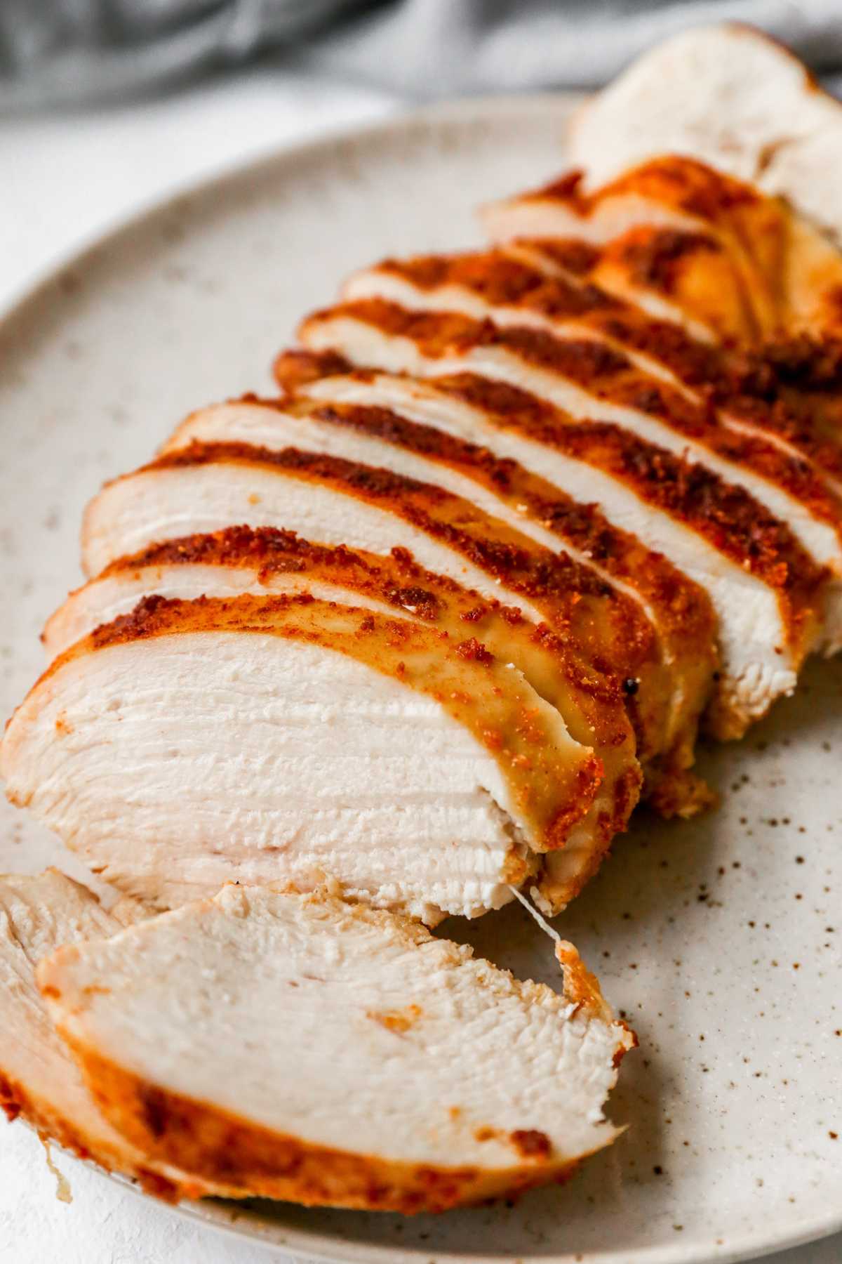 Sliced chicken breast on a plate.