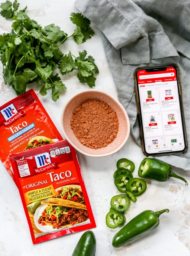 taco seasoning in a bowl and packages of taco seasoning