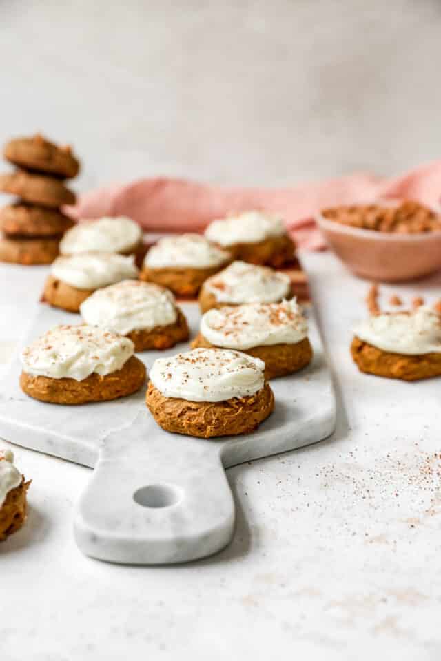 soft pumpkin cookies made with cake mix on a marble tray