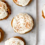 cake mix cookies topped with cream cheese frosting on a marble tray