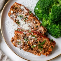 slices of an easy meatloaf recipe served with broccoli