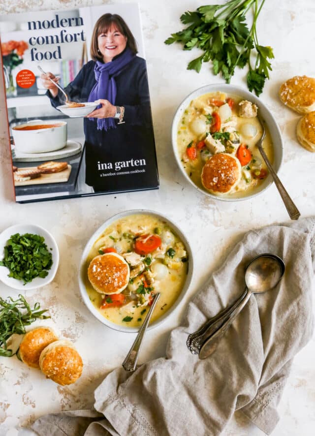 chicken pot pie soup served in bowls next to Ina Garten's new cookbook