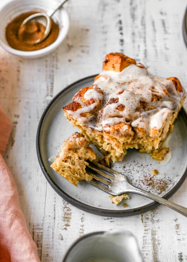 cinnamon roll bake on a plate with a fork