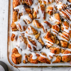 cinnamon roll casserole topped with icing