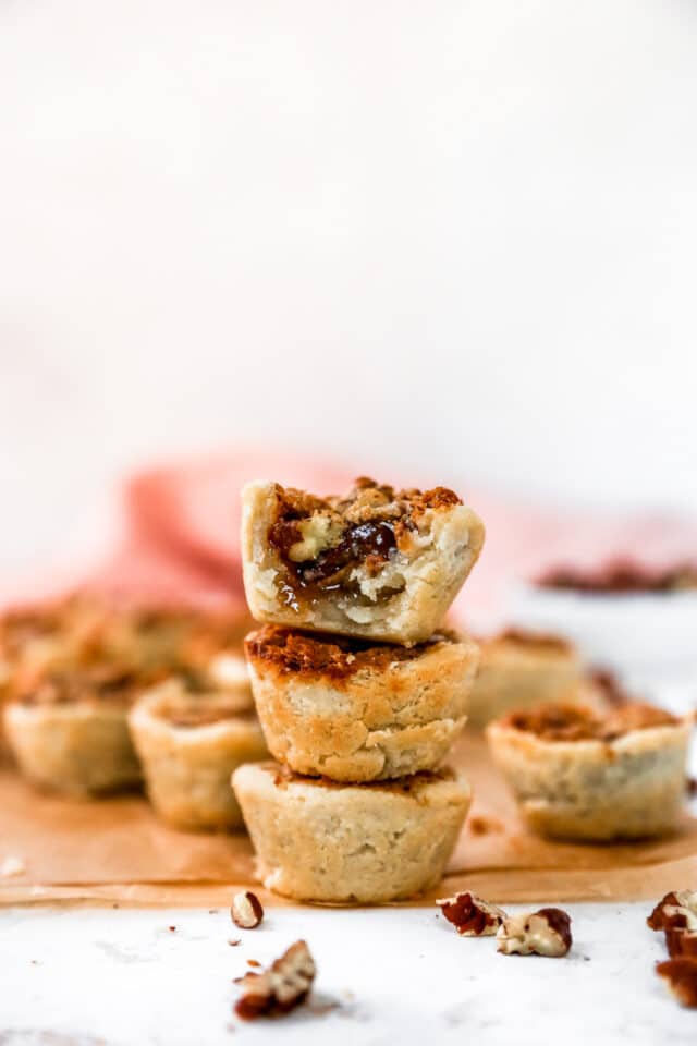 three mini pecan pies stacked on top of each other